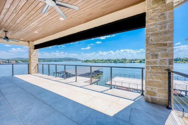 a balcony with furniture and wooden floor