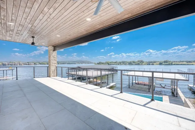 a view of a balcony with chairs