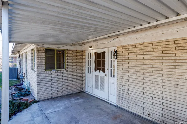 a view of a porch with a door