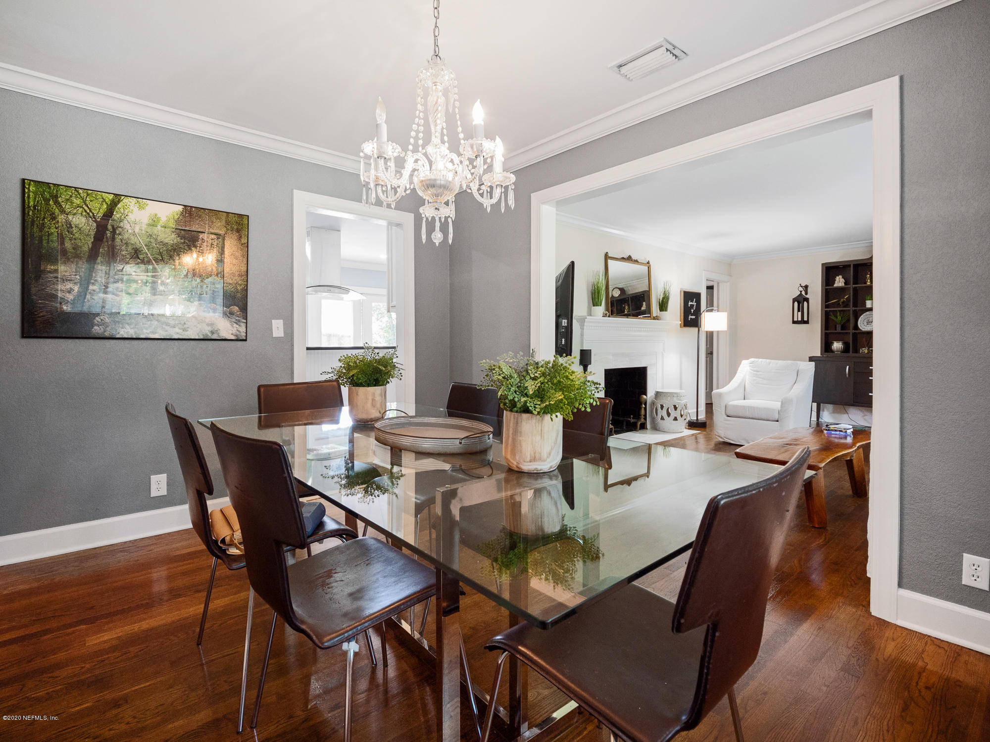 6319 Wesleyan Road Jacksonville, FL 32217 - Photo 8 of 24 a view of a dining room with furniture wooden floor and chandelier