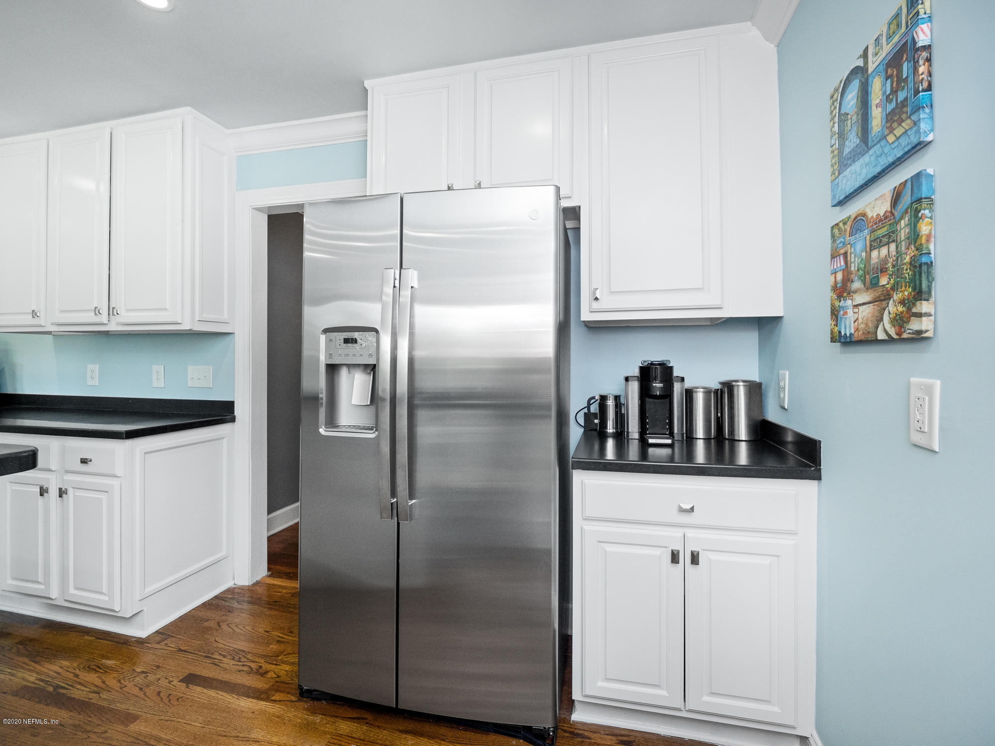 6319 Wesleyan Road Jacksonville, FL 32217 - Photo 10 of 24 a kitchen with stainless steel appliances a refrigerator and cabinets
