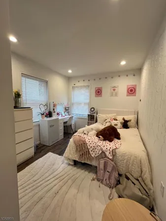 a bedroom with a bed and a cabinets