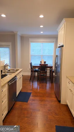 a kitchen with lots of counter top space and stainless steel appliances