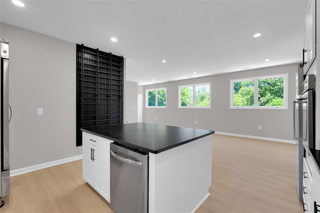 159 Cherokee Trail Easley, SC 29640 - Photo 14 of 38 This kitchen presents a sleek, contemporary design with light hardwood flooring and recessed lighting.