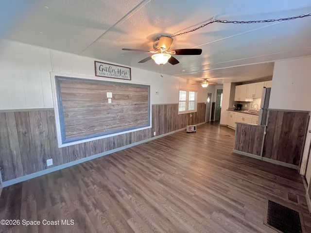 a view of a livingroom with wooden floor