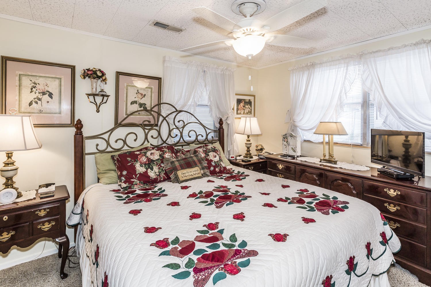101 Parsons Road Oak Ridge, TN 37830 - Photo 24 of 31 a bedroom with a bed and a flat tv screen on the dresser
