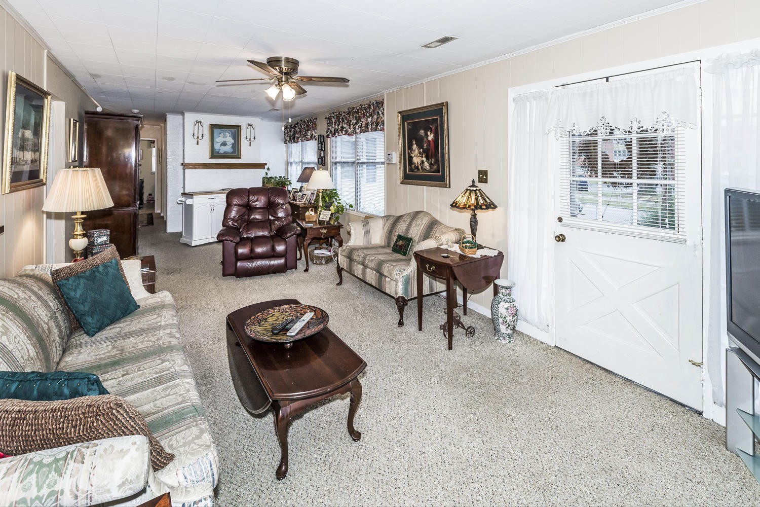 101 Parsons Road Oak Ridge, TN 37830 - Photo 9 of 31 a living room with furniture a fireplace and a window