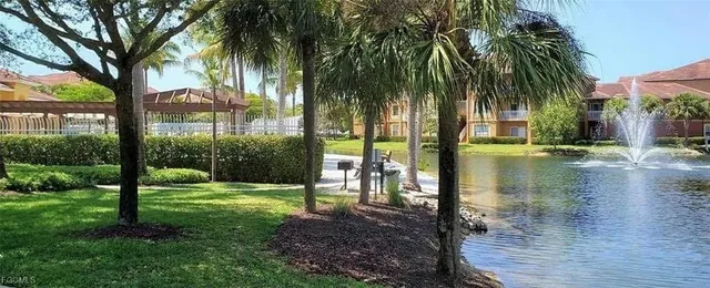 a view of swimming pool with a table and chairs