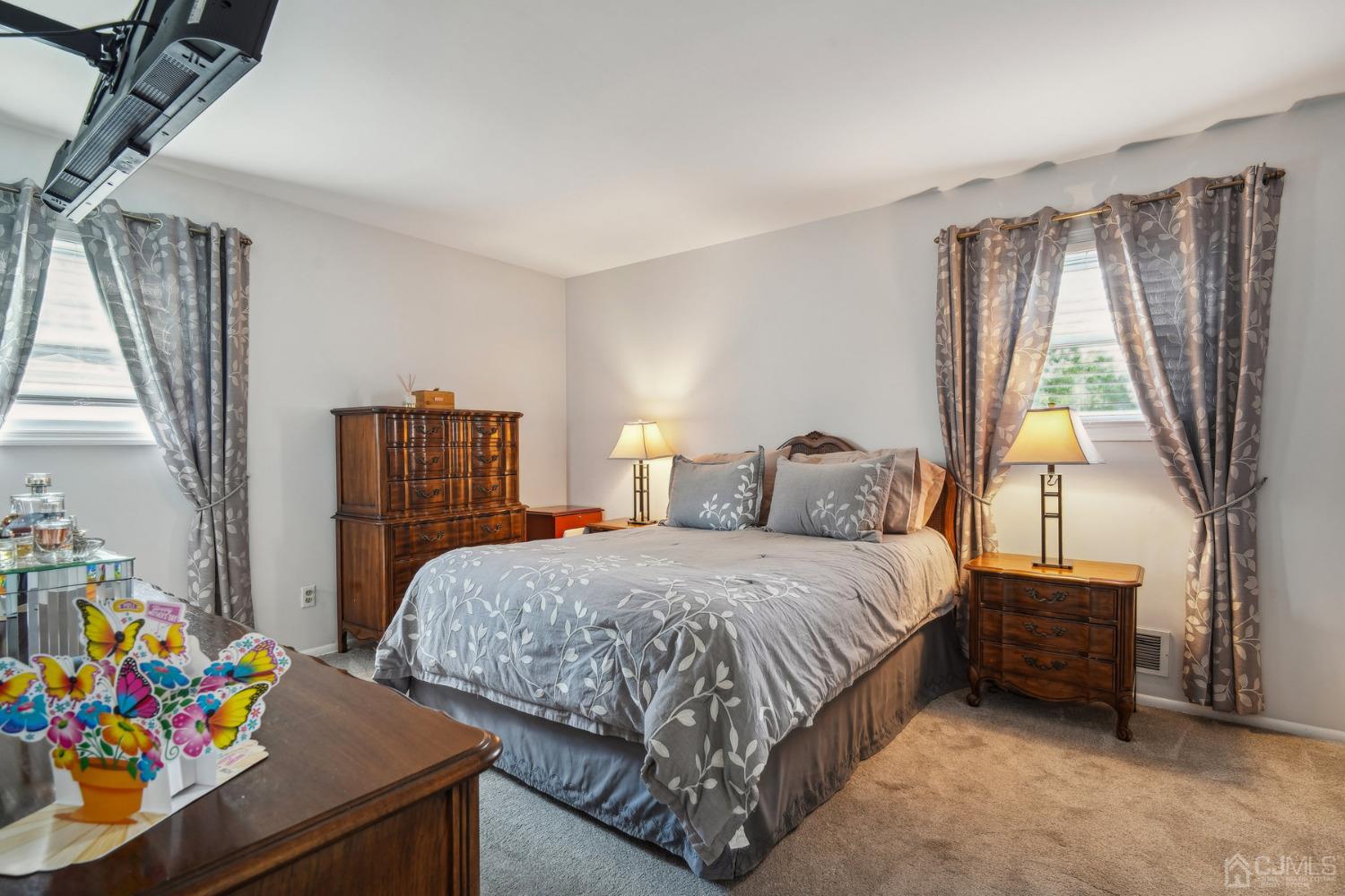 418 Durham Avenue Edison, NJ 08817 - Photo 12 of 30 a bedroom with a bed and a dresser