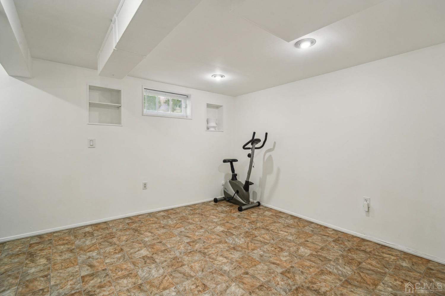 418 Durham Avenue Edison, NJ 08817 - Photo 16 of 30 a view of a room with gym equipment