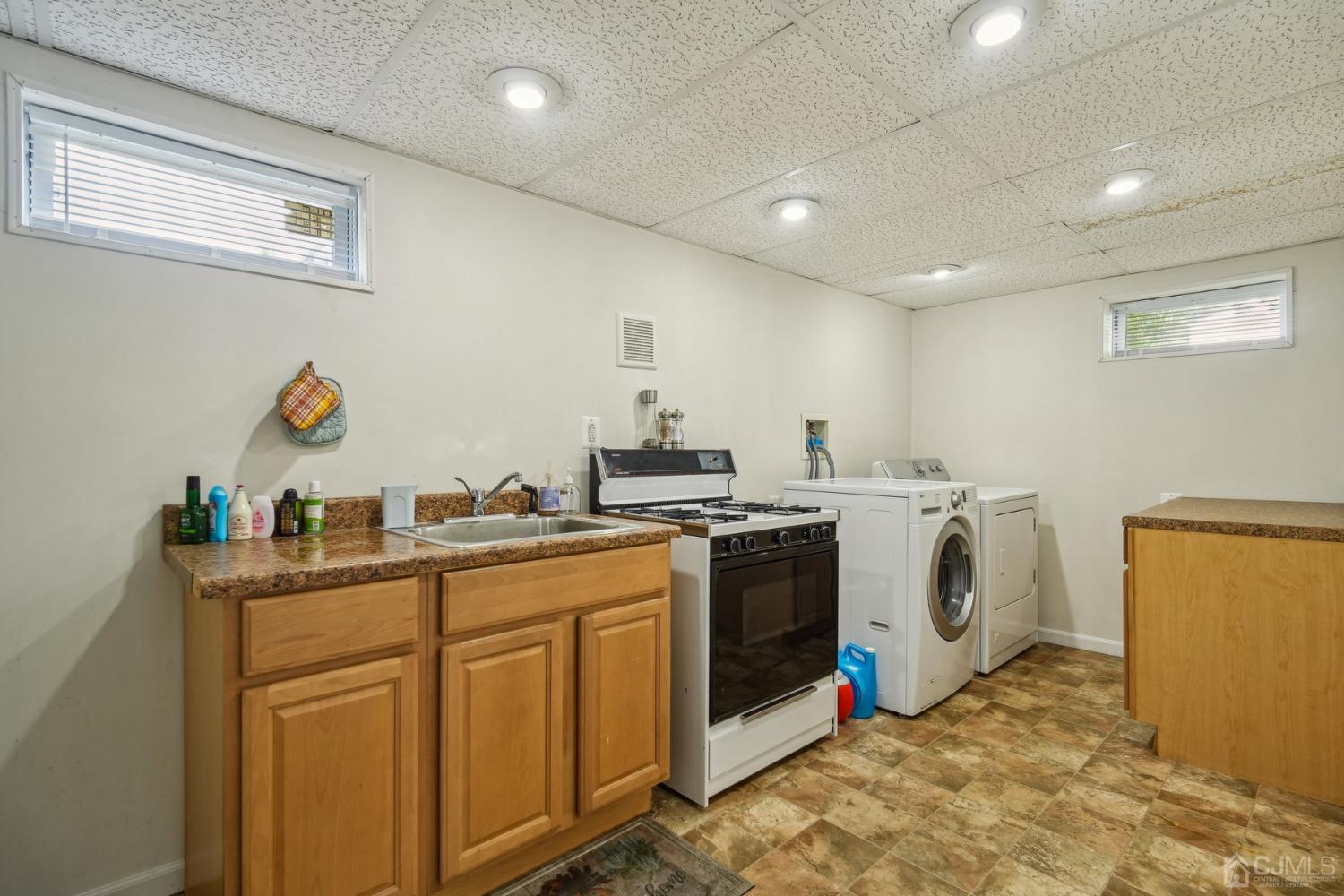 418 Durham Avenue Edison, NJ 08817 - Photo 17 of 30 a kitchen with cabinets appliances and a counter top space