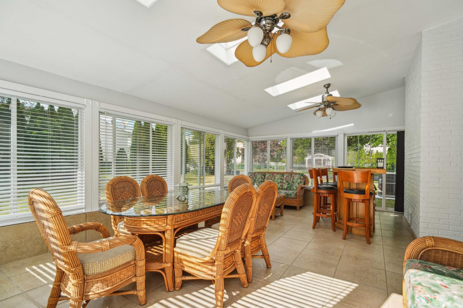 418 Durham Avenue Edison, NJ 08817 - Photo 18 of 30 a dining room with furniture large windows a chandelier