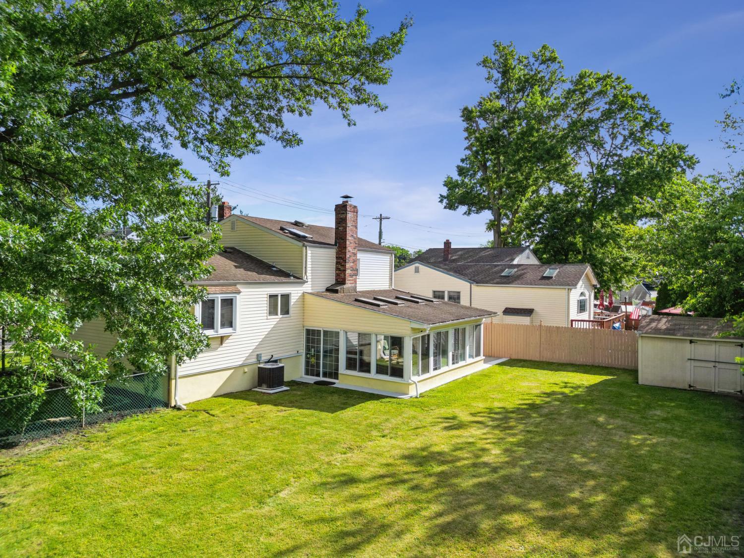 418 Durham Avenue Edison, NJ 08817 - Photo 19 of 30 a front view of a house with a garden and deck