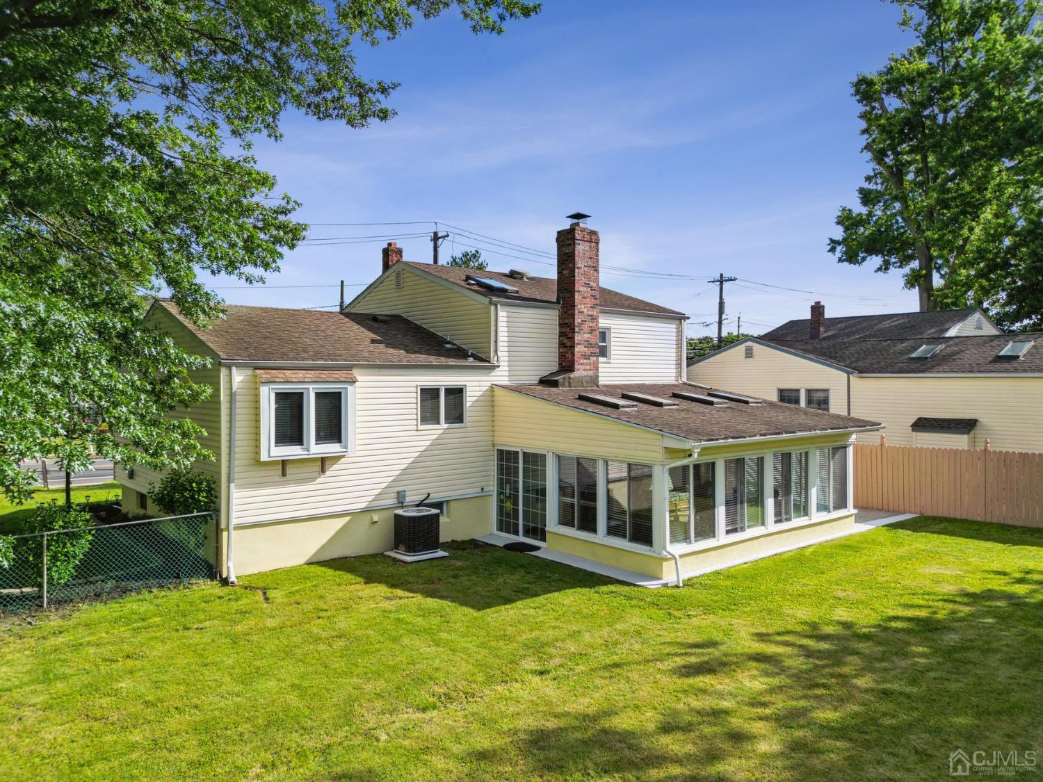 418 Durham Avenue Edison, NJ 08817 - Photo 20 of 30 a view of a house with a backyard porch and sitting area
