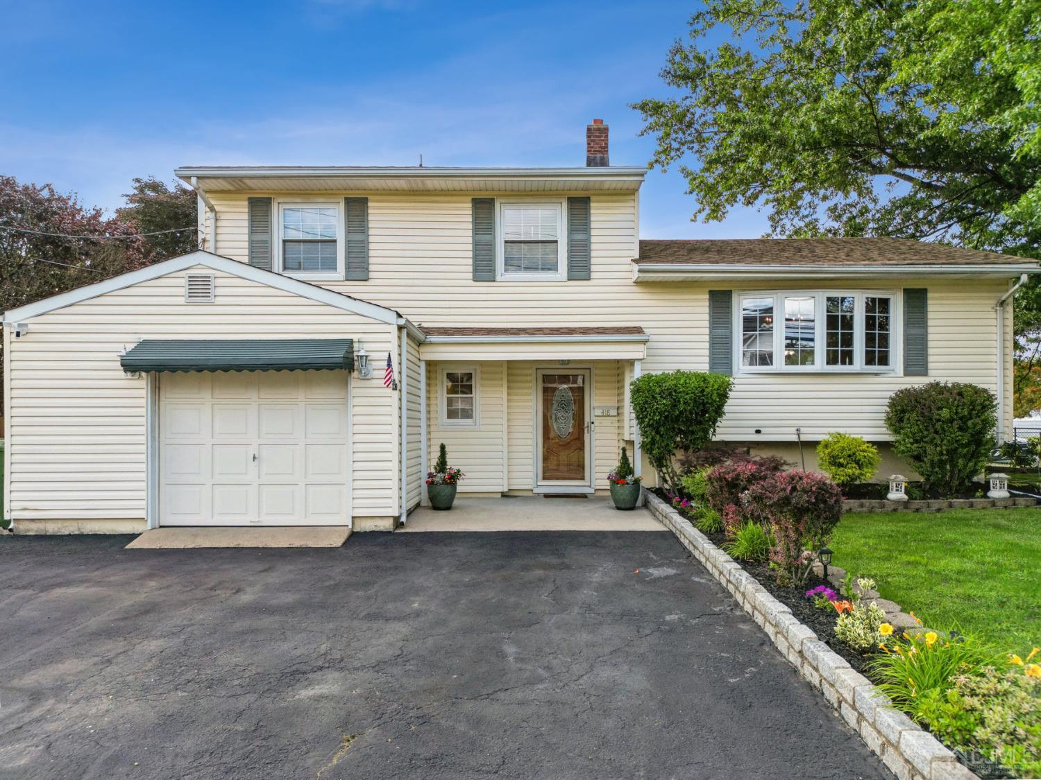 418 Durham Avenue Edison, NJ 08817 - Photo 2 of 30 front view of a house with a yard