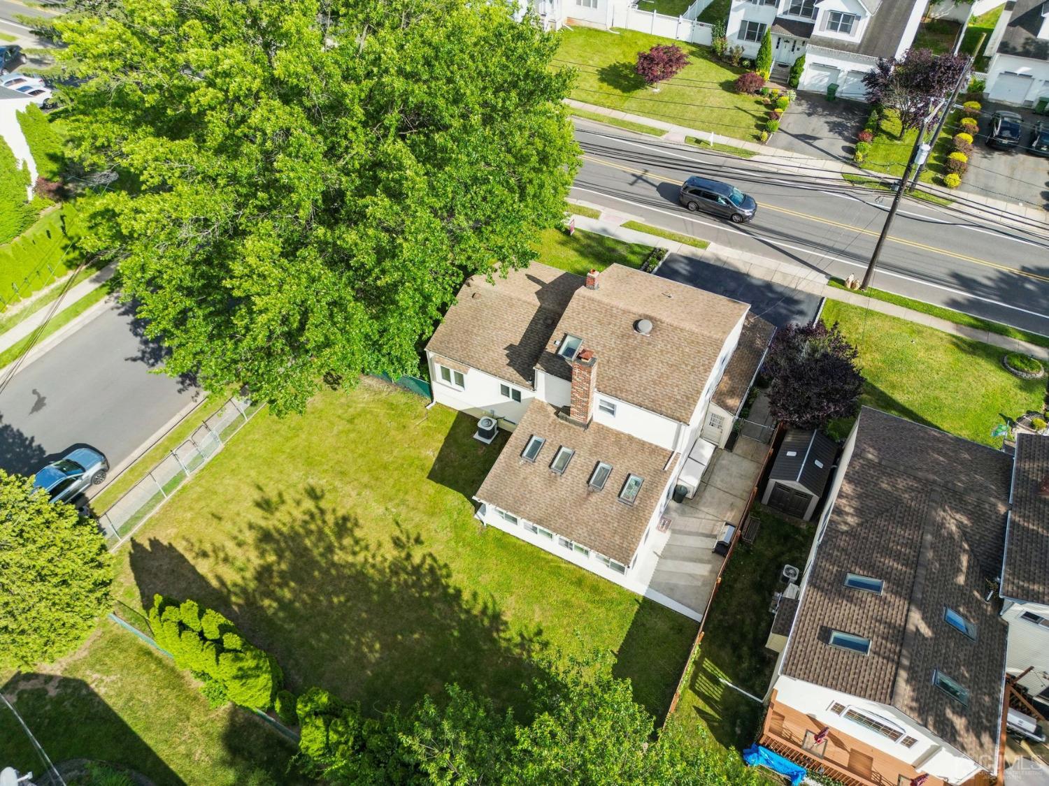 418 Durham Avenue Edison, NJ 08817 - Photo 21 of 30 an aerial view of a house with a garden and lake view