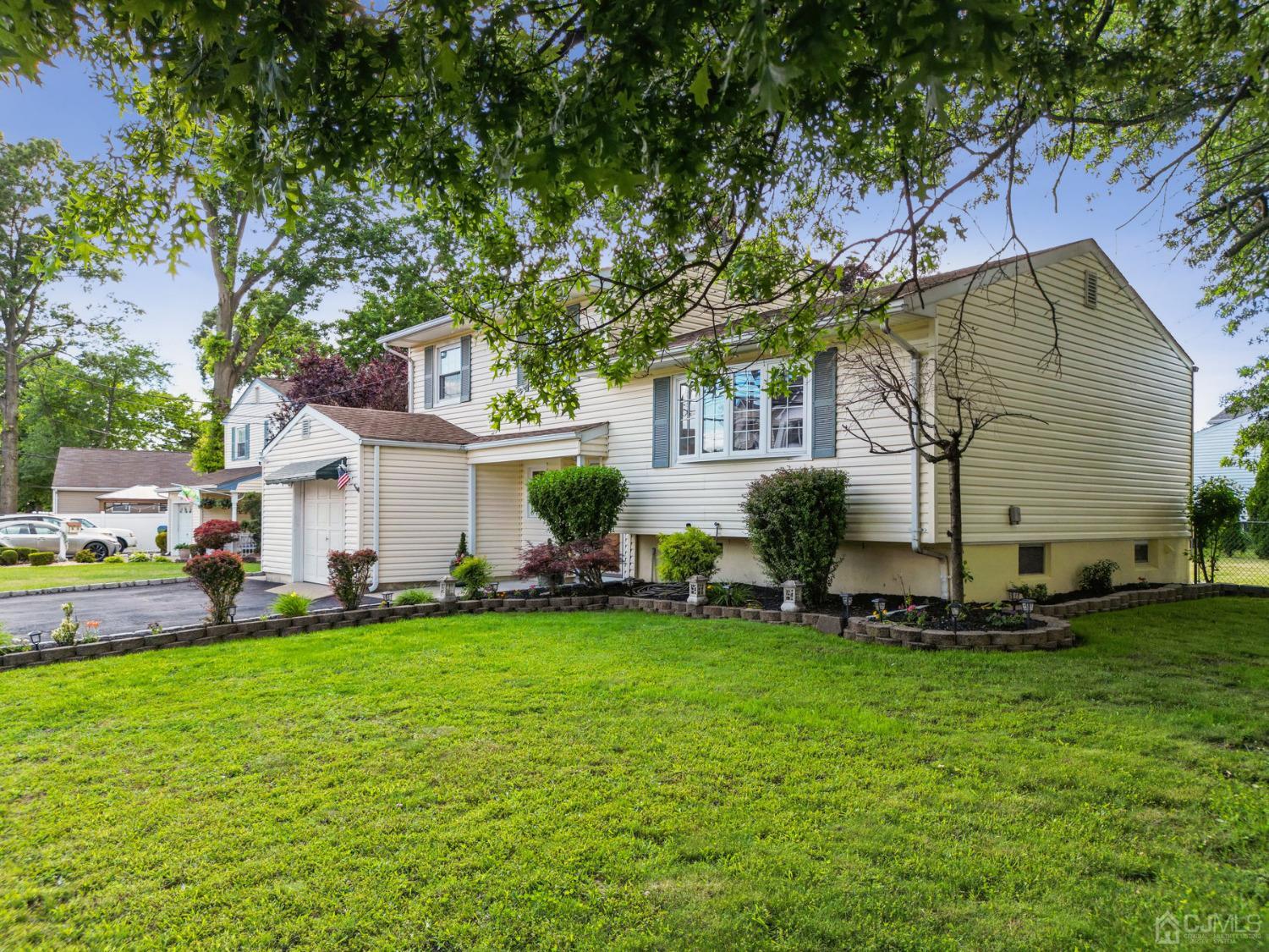 418 Durham Avenue Edison, NJ 08817 - Photo 3 of 30 a view of a house with a yard and sitting area