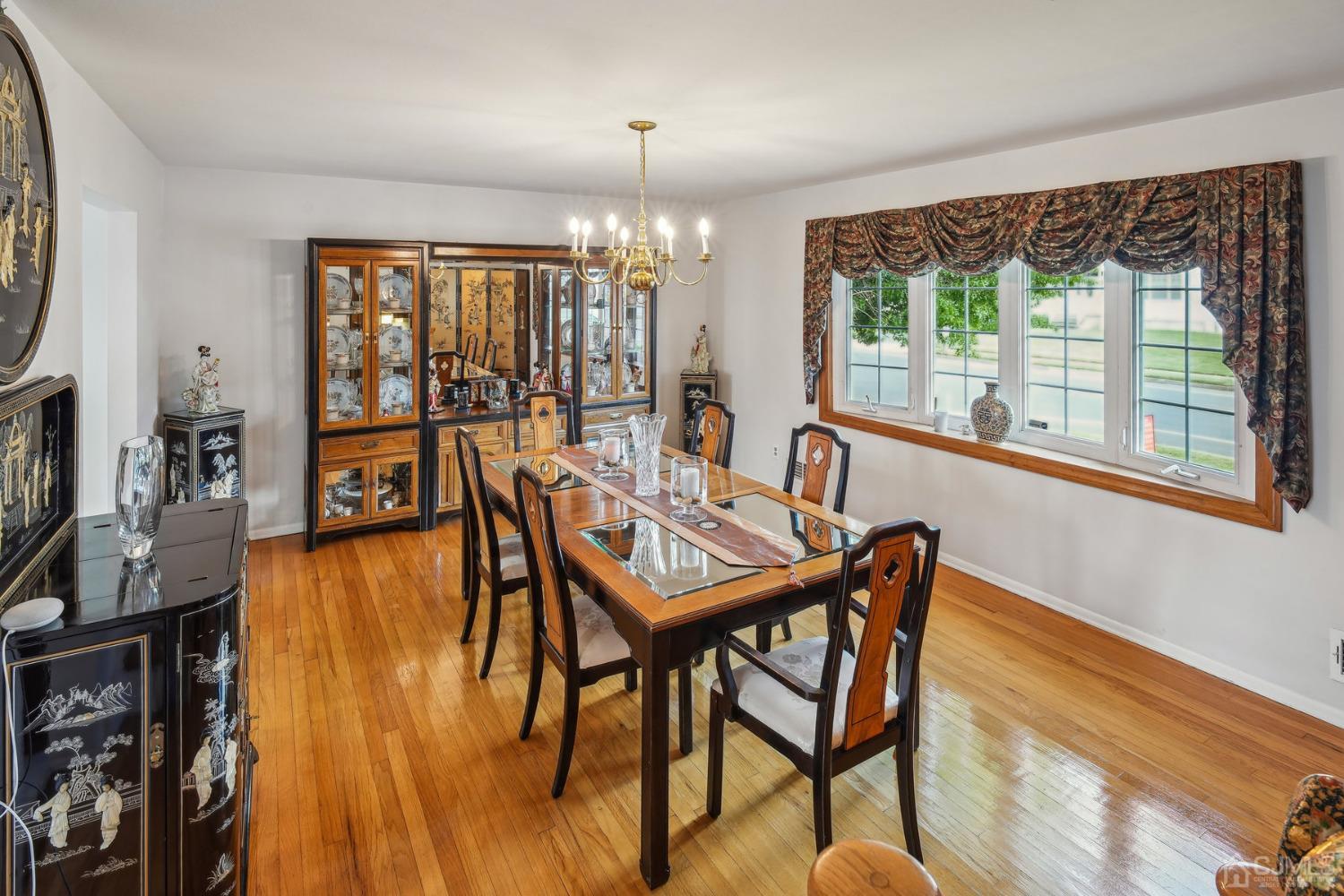418 Durham Avenue Edison, NJ 08817 - Photo 7 of 30 a dining room with furniture water view and wooden floor