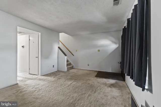 a view of a hallway with a white walls