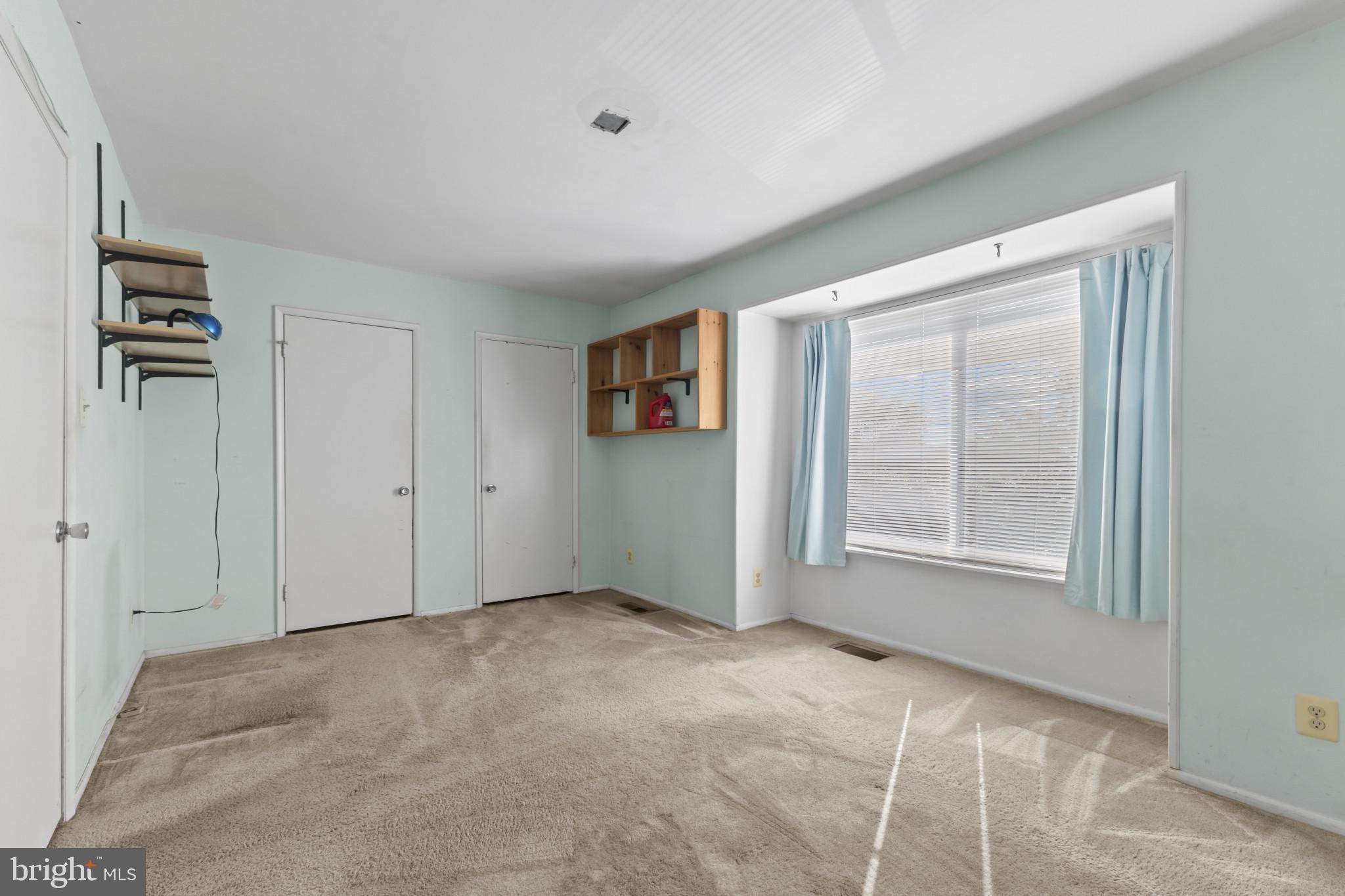 1808 Westwind Way, Unit 79 McLean, VA 22102 - Photo 14 of 24 a view of an empty room with a window