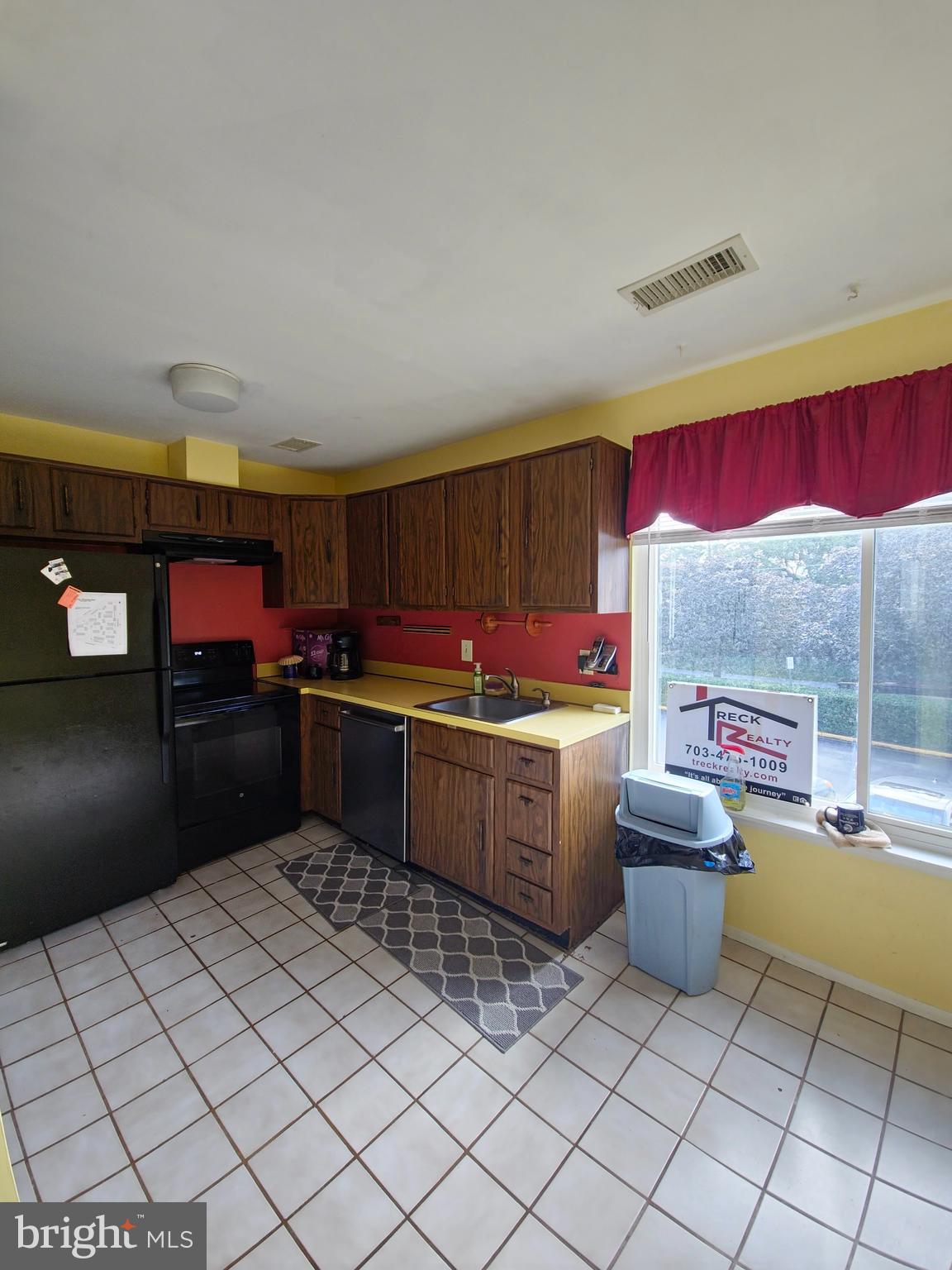 1808 Westwind Way, Unit 79 McLean, VA 22102 - Photo 24 of 24 a kitchen with stainless steel appliances kitchen island granite countertop a refrigerator and a stove