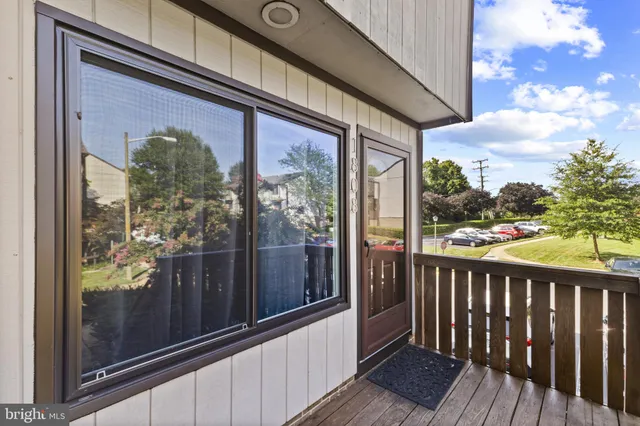 a view of a balcony with wooden floor and city view