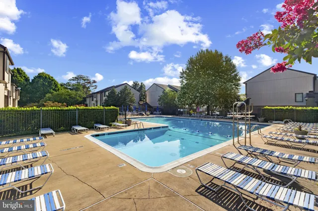 a view of a swimming pool with a patio