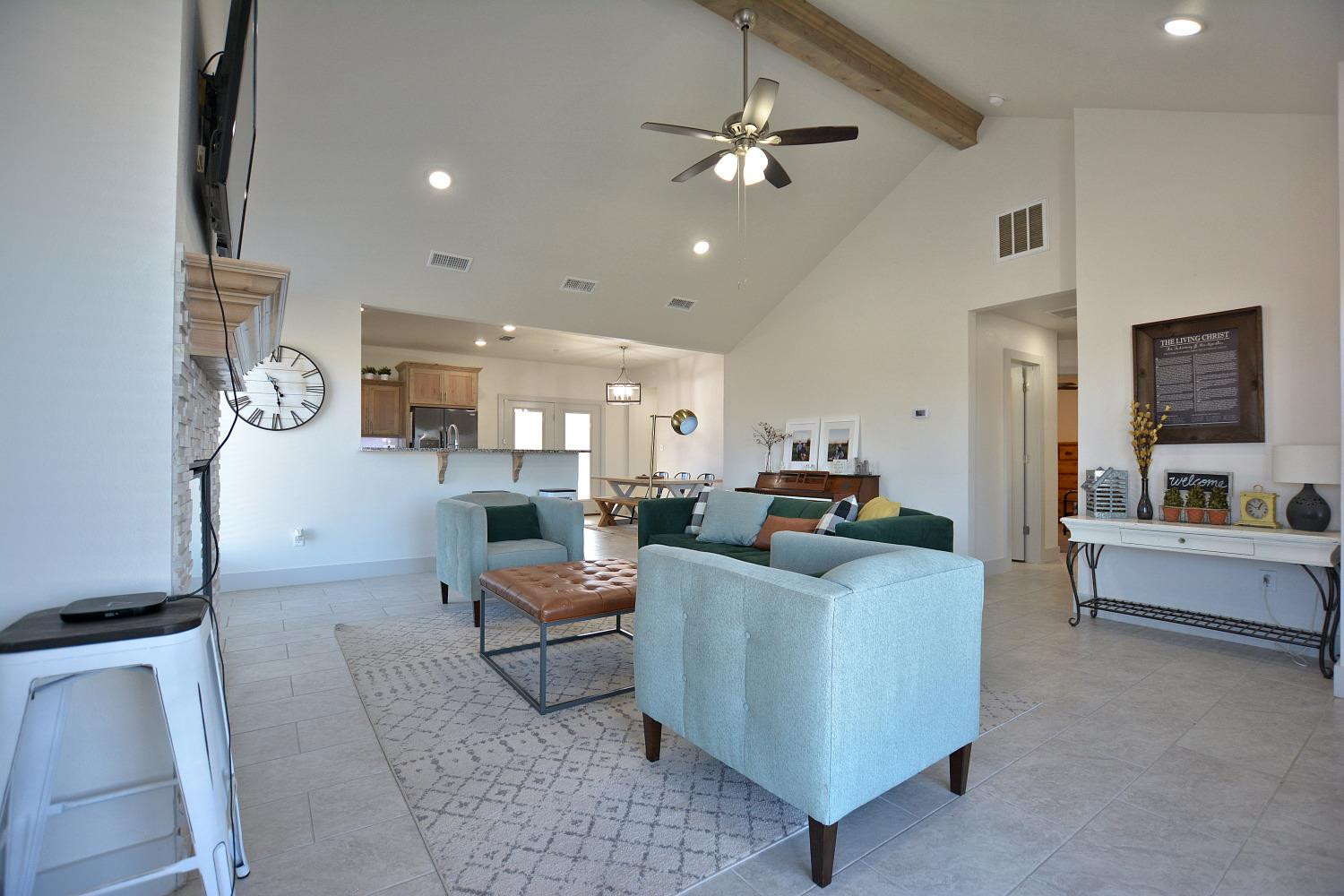 8901 Winfield Avenue Lubbock, TX 79424 - Photo 4 of 22 a living room with furniture and a chandelier