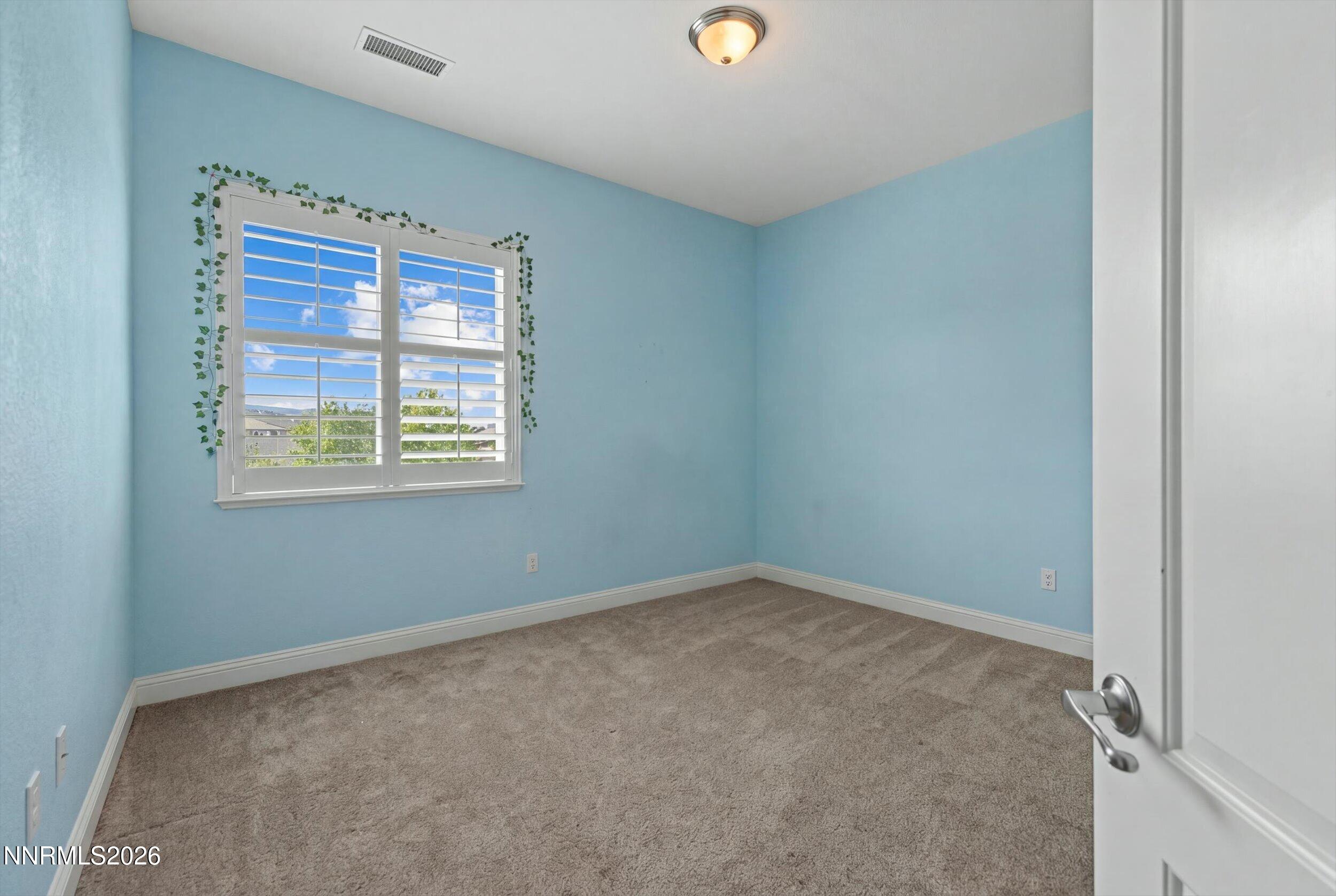 2920 Bull Rider Drive Reno, NV 89521 - Photo 26 of 51 an empty room with windows