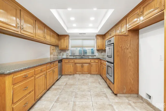 a view of a house with a yard porch and sitting area