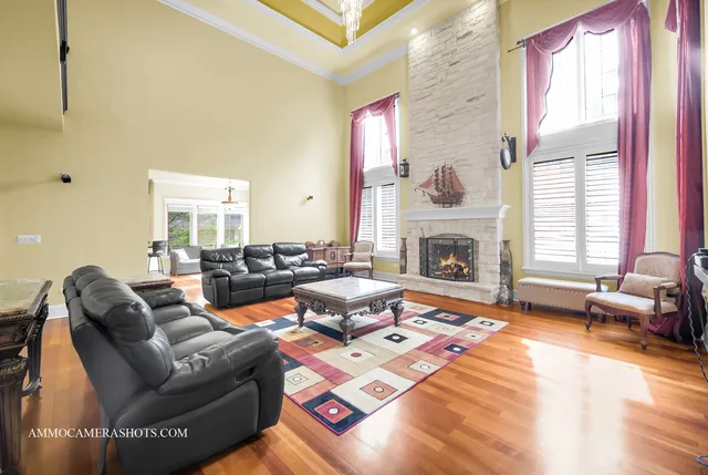 a living room with furniture fireplace and flat screen tv
