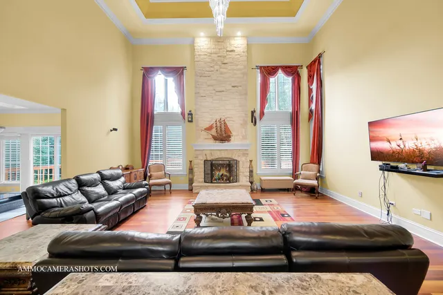 a living room with furniture fireplace and a flat screen tv