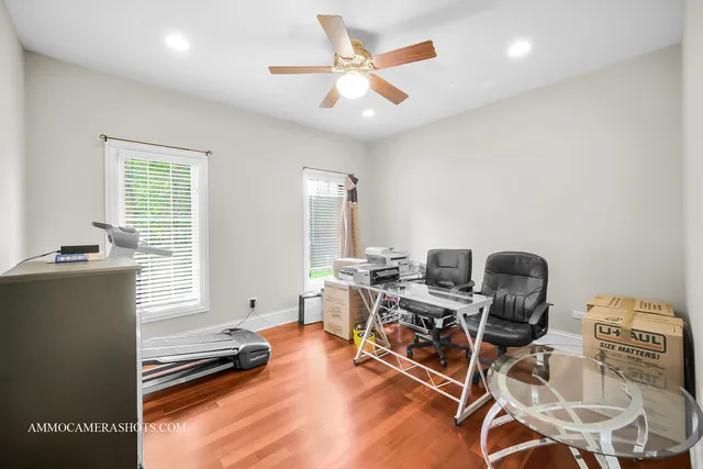 a spacious bedroom with a large bed and a large window