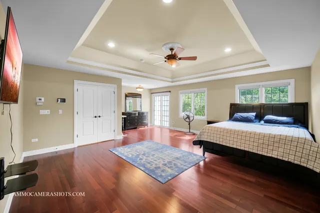 a view of an entryway with wooden floor
