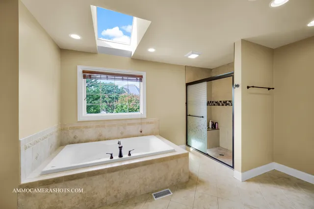 a bathroom with a sink a large mirror and a shower