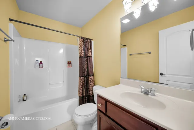 a view of a house with a yard and plants