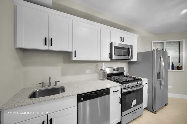 an aerial view of a house with a yard and garden