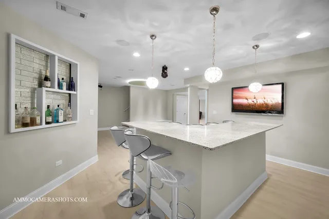 an aerial view of a house yard and outdoor seating