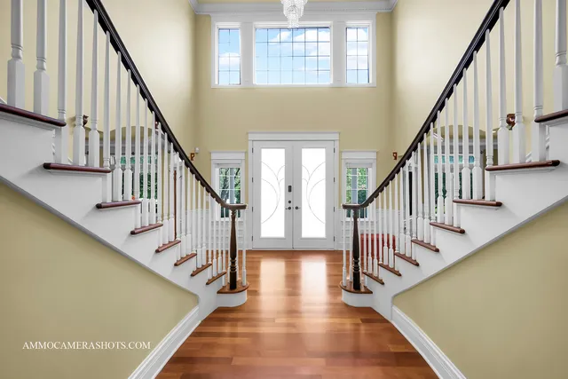 a view of a livingroom with furniture and stairs