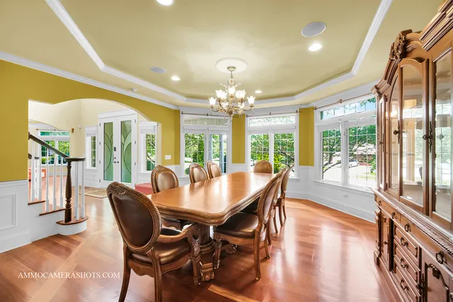 a living room with fireplace furniture and a wooden floor
