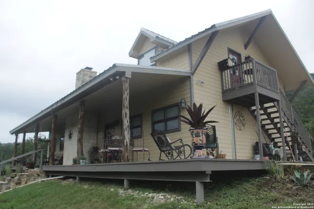 a view of house with roof deck