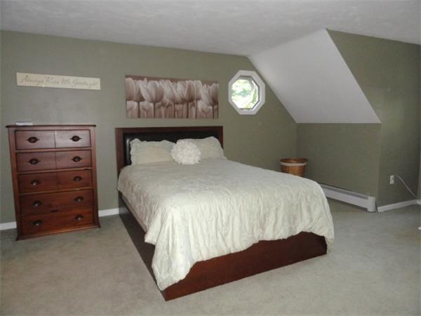 54 Clarke Road Needham, MA 02492 - Photo 15 of 29 a bedroom with a bed and a lamp on dresser