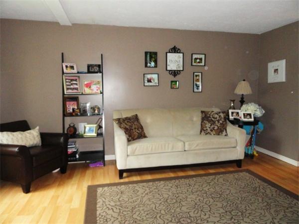 54 Clarke Road Needham, MA 02492 - Photo 2 of 29 a living room with furniture and painting on the wall
