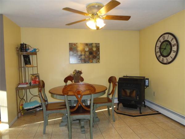 54 Clarke Road Needham, MA 02492 - Photo 7 of 29 a view of a dining room with furniture and chandelier