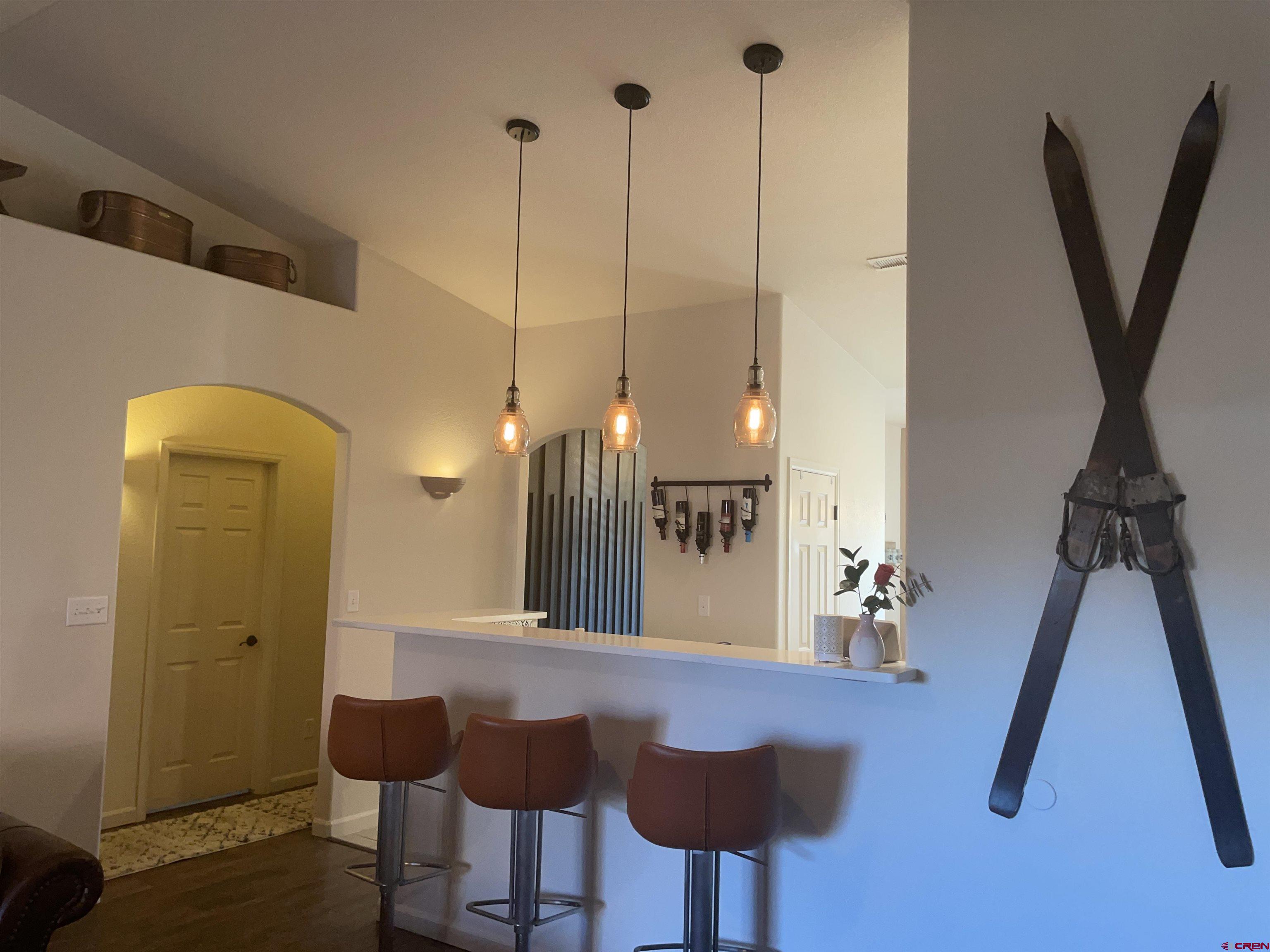 524 Cougar Run Fruita, CO 81521 - Photo 10 of 31 a view of a dining room with furniture and a chandelier