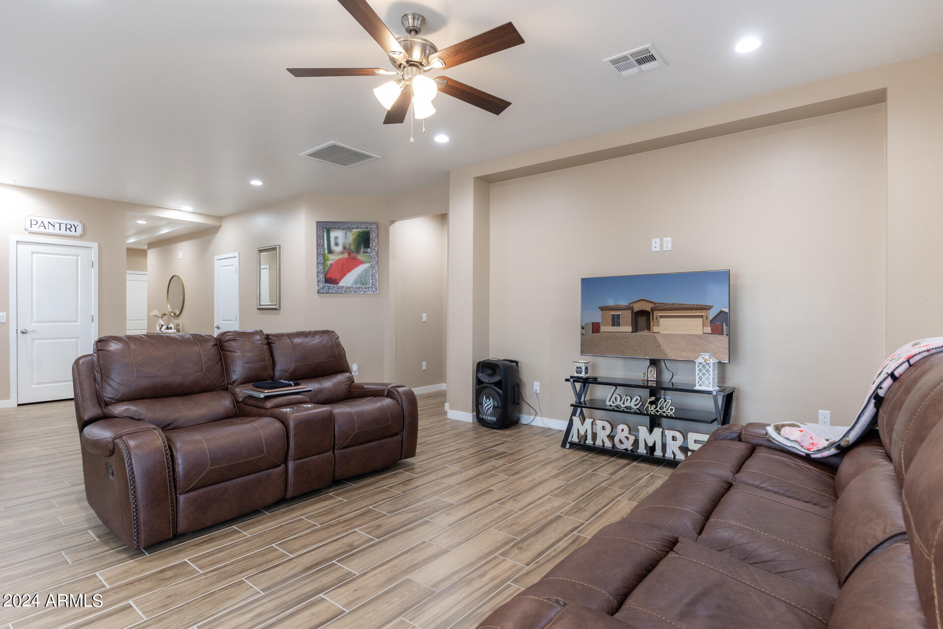 14594 South Avalon Road Arizona City, AZ 85123 - Photo 20 of 21 a living room with furniture and a wooden floor