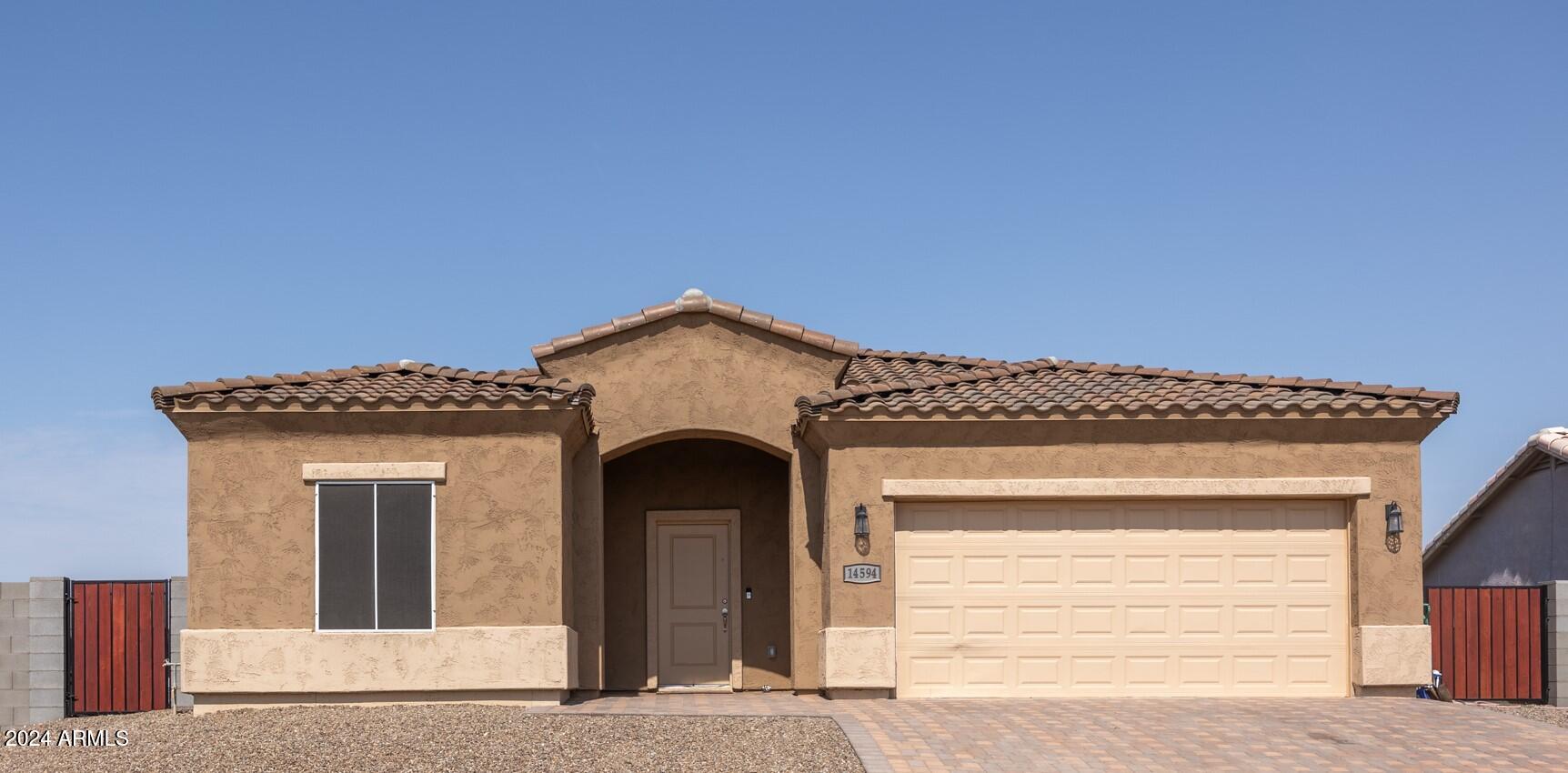 14594 South Avalon Road Arizona City, AZ 85123 - Photo 2 of 21 a view of a wooden door of the house