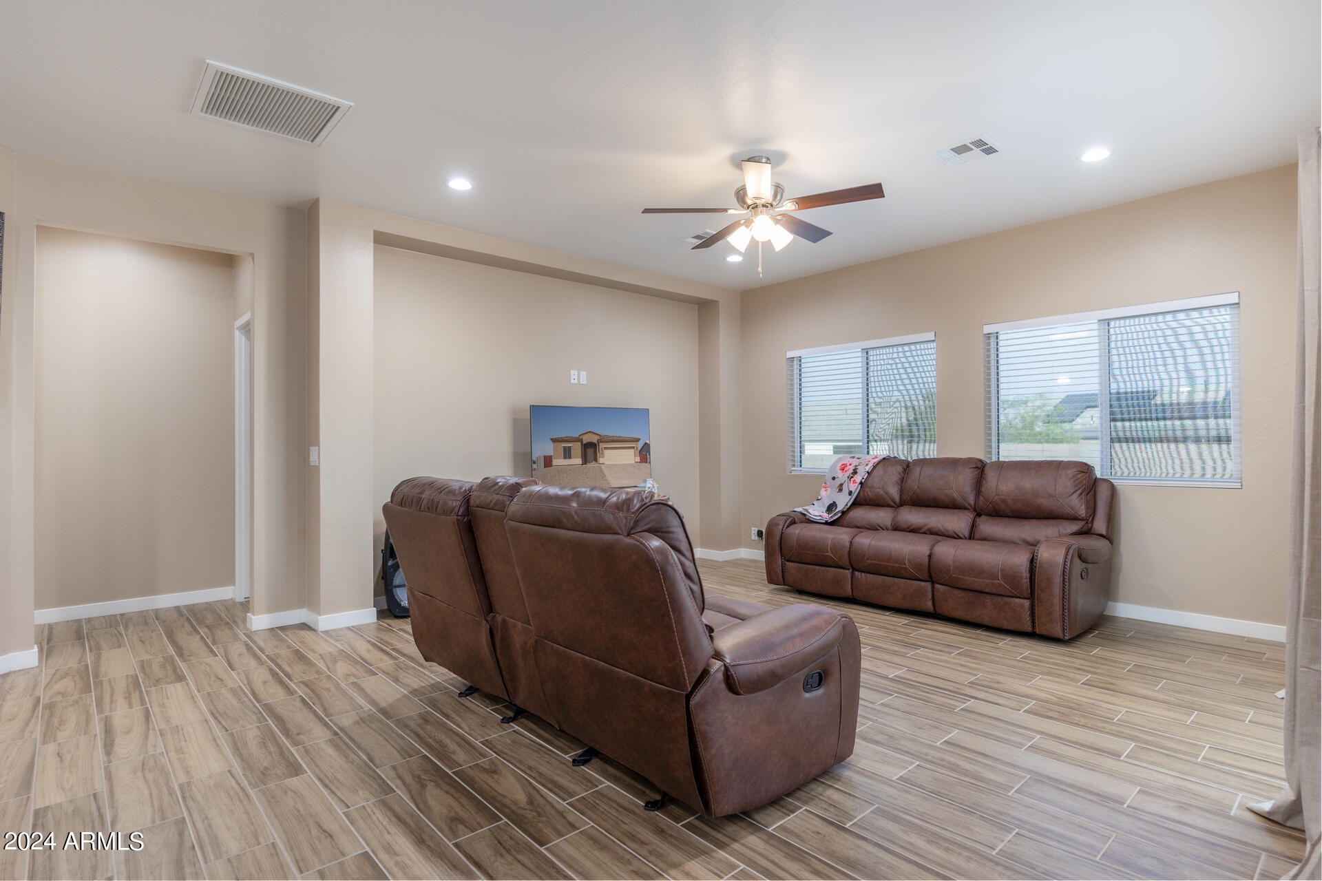 14594 South Avalon Road Arizona City, AZ 85123 - Photo 21 of 21 a living room with furniture and a wooden floor