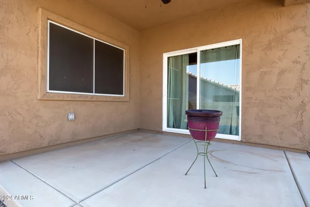 a view of a hallway with a glass door and a floor to ceiling window