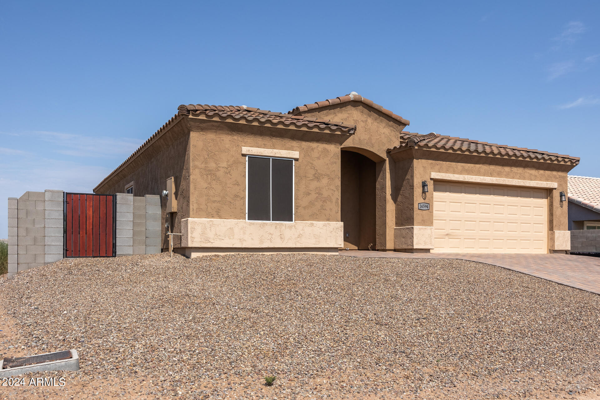 14594 South Avalon Road Arizona City, AZ 85123 - Photo 7 of 21 a front view of a house with a garage